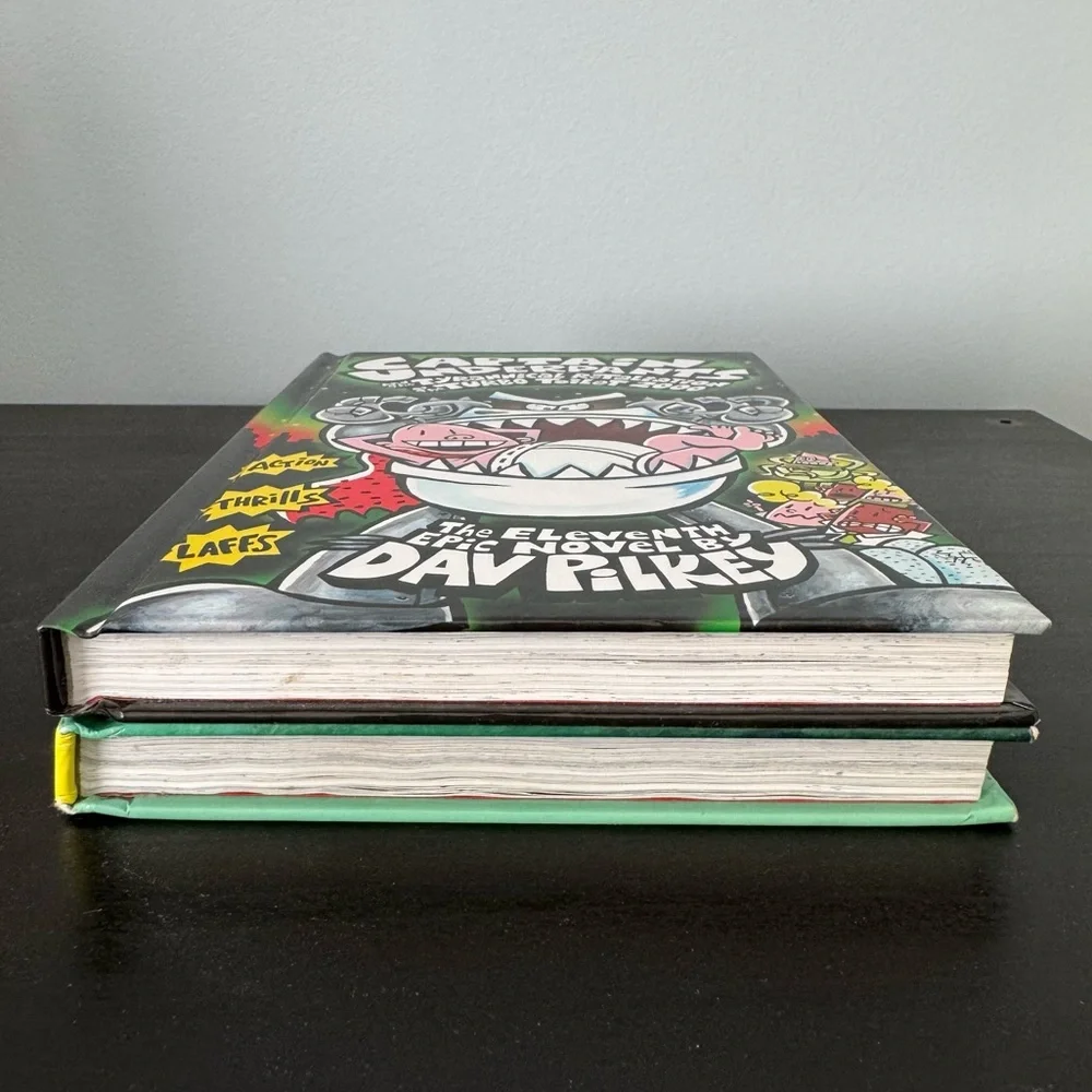 2 Captain Underpants hardcover books by Dav Pilkey. Tyrannical Revolting Revenge